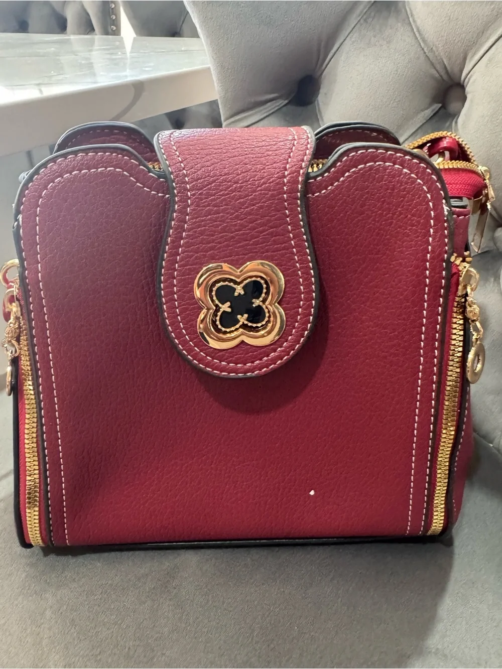 Classic Red Leather Crossbody Bag with Gold Accents
